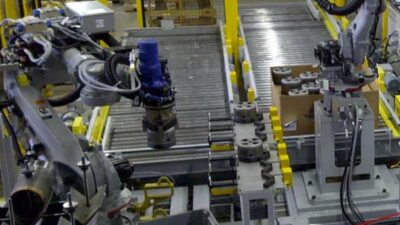Two robots work together, with the threader on the left and the bin picker on the right. Courtesy: Cognex, JMP Engineering