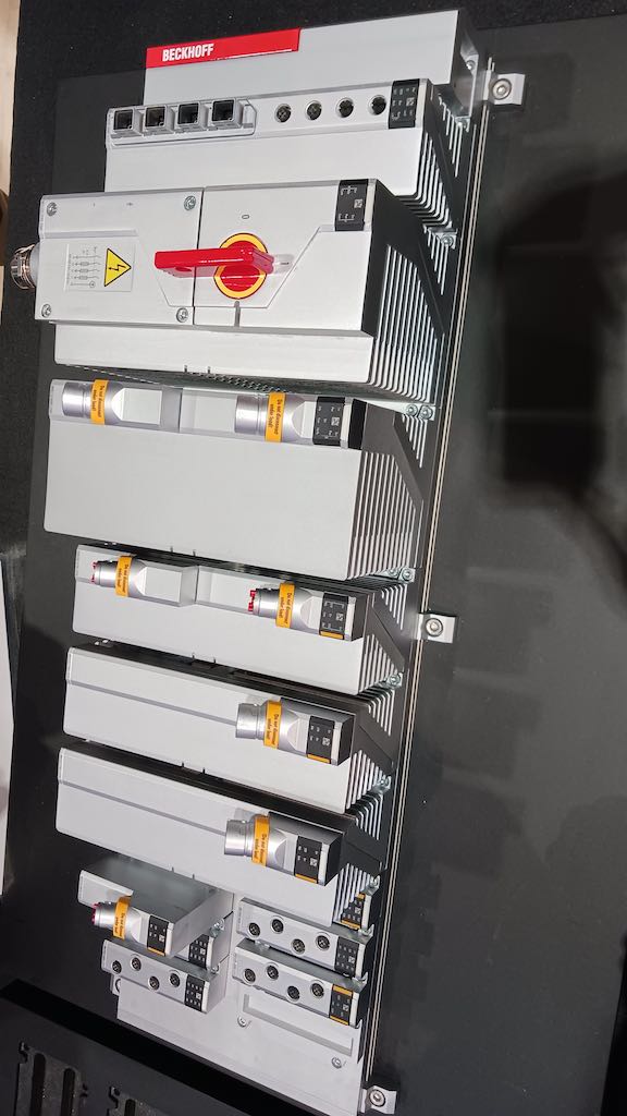 Under development for expected release in mid-2024, the Beckhoff MX System, a rugged, industrial cabinet-less machine control platform, (photo) provides modular, integrated, hot-swappable control system components (controllers, I/O modules, communications and power supplies), as shown at ProMat 2023. The MX System will be programmable with Beckhoff TwinCAT software. Courtesy: Mark T. Hoske, Control Engineering