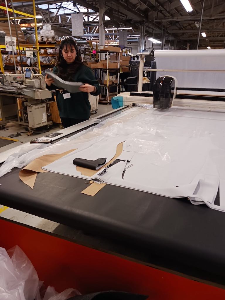 Multiple layers of fabric are cut using CNC-provided instructions at the Freedman Seating Co. location in Chicago. CNC also is used for some sewing (not shown). Courtesy: Mark T. Hoske, Control Engineering