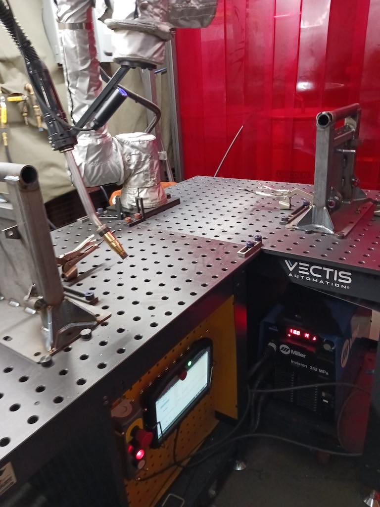 Vectis Automation provided two automated welding cells (one shown) that work on seat bases using Universal Robots collaborative robots, wrapped for the Freedman Seating application. Courtesy: Mark T. Hoske, Control Engineering