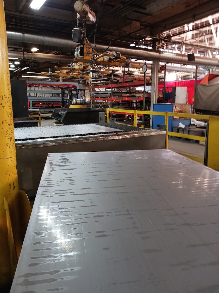 Rolled steel, a little larger than a 4 by 8 ft sheet of plywood, awaits laser cutting at Freedman Seating Co. Courtesy: Mark T. Hoske, Control Engineering