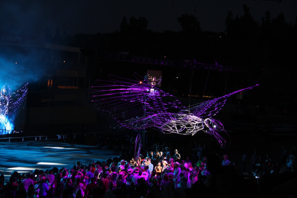A fabricated eagle flies over an audience in the Calgary Stampede grandstand show, first with an actor, then alone, as shown in the April 17 STEM Café presentation, “Theatrical Special Effects: Engineering Spectacle,” by Tracy Nunnally, MFA, Northern Illinois University (NIU) professor, technical director, head of design and technology, School of Theatre and Dance. 