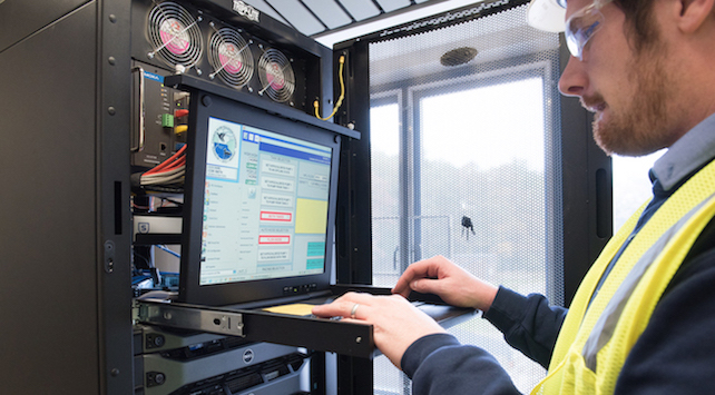Figure 1: A control systems engineer works on a human machine interface/supervisory control and data acquisition system server. Courtesy of CDM Smith.