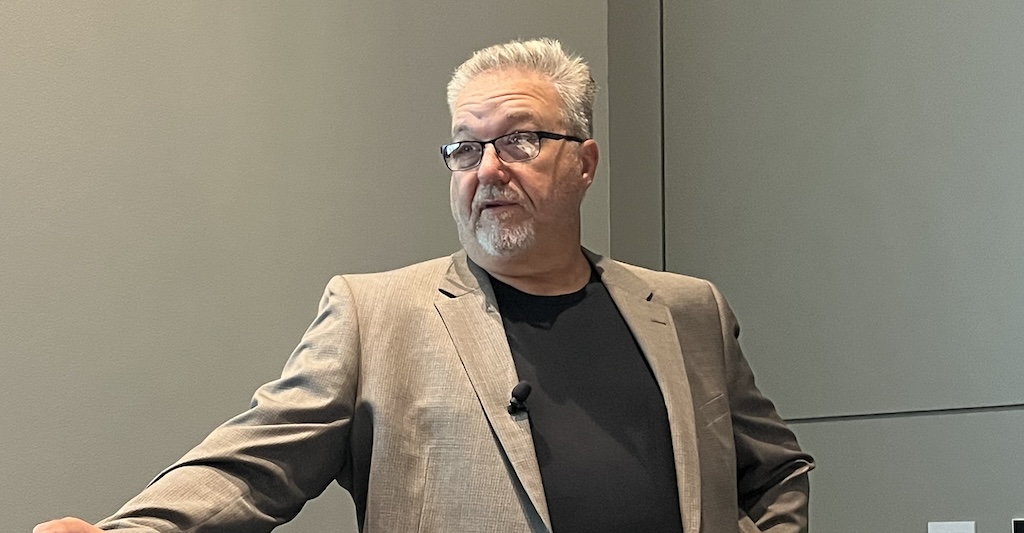 Eric Whitley, director of industrial transformation at L2L, in his presentation “Transforming Continuous Improvement: The Role of AI and Connected Worker Technology” at IMTS 2024 in Chicago. 