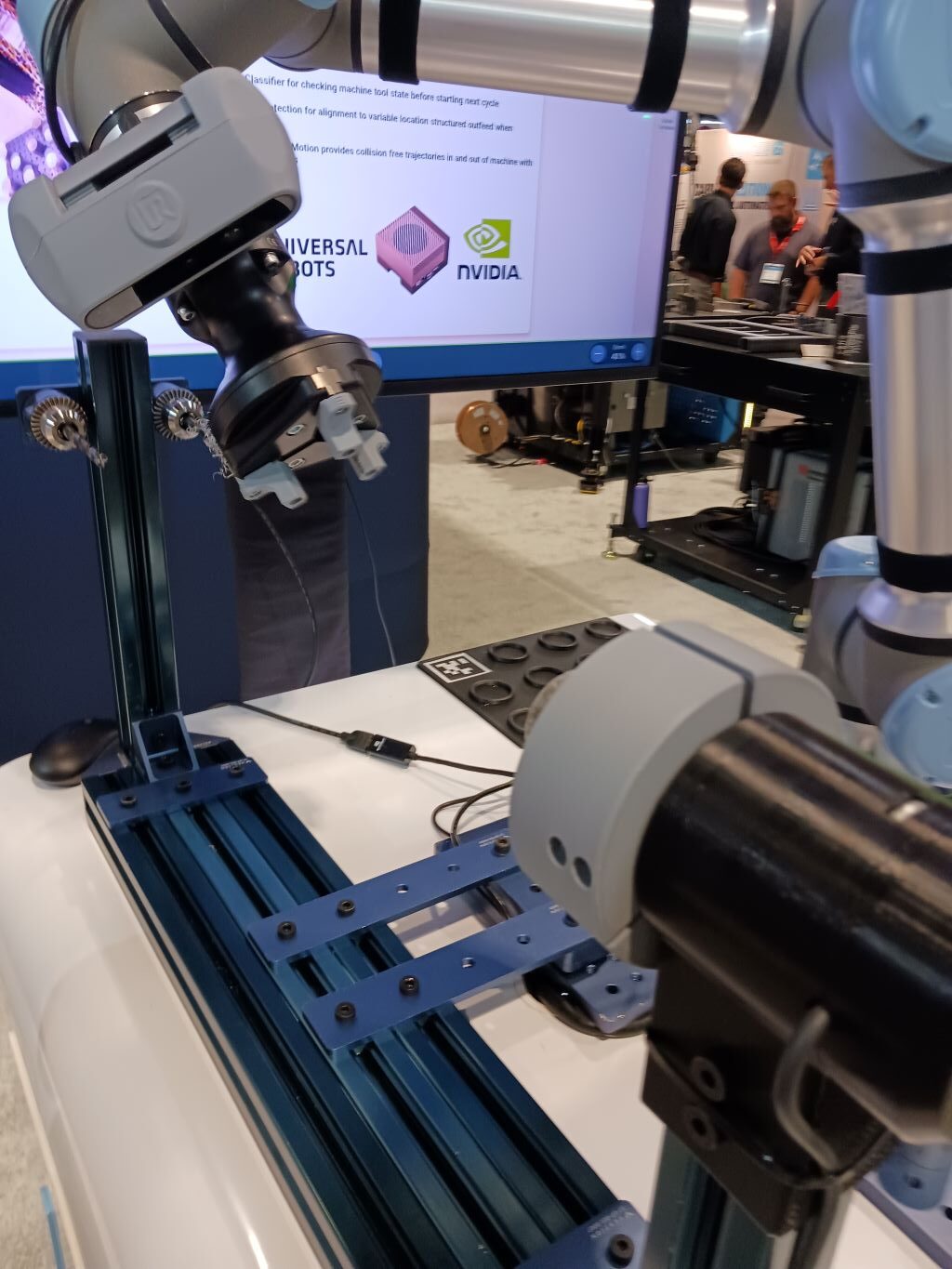 Faster machine tending is enabled with new AI-based perception capabilities running on Nvidia Jetson and Isaac acceleration libraries integrated into Universal Robots new PolyScope X platform, as seen at the UR IMTS 2024 booth. Courtesy: Mark T. Hoske, WTWH Media