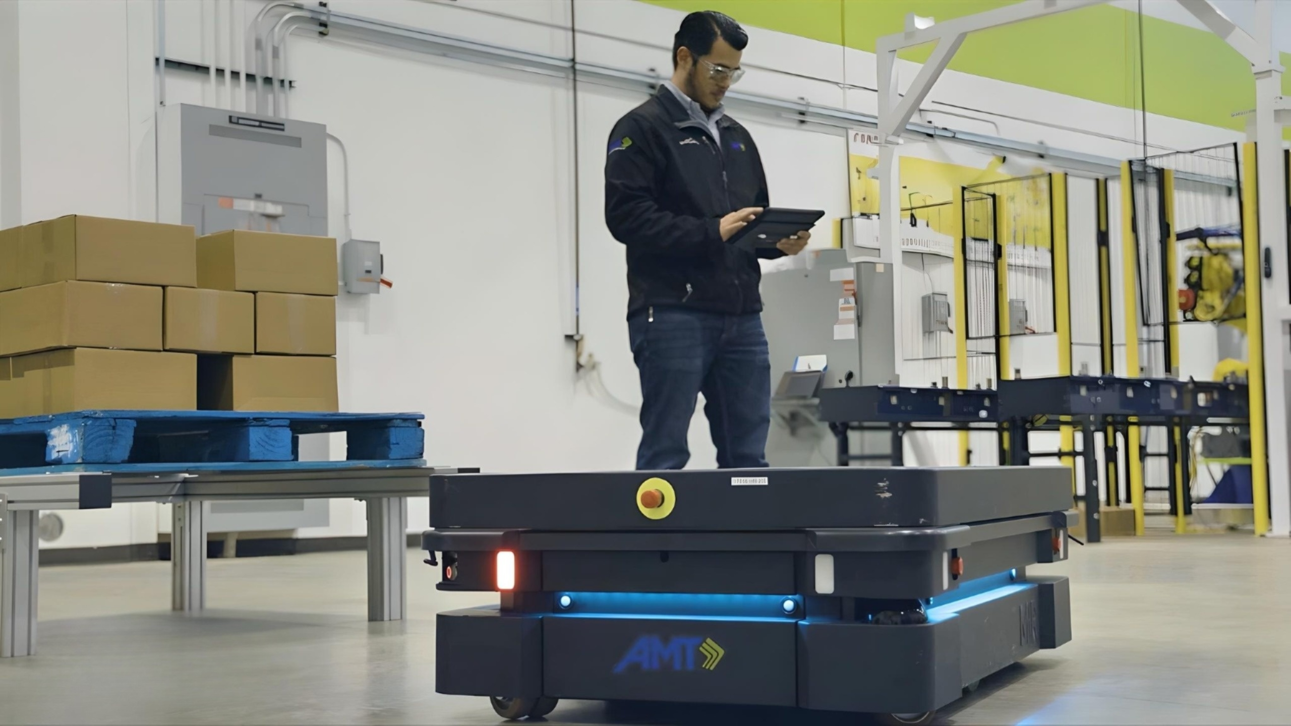 Figure 2: An engineer supervises the operation of MiR's autonomous mobile robot, designed for efficient material handling in industrial environments. Courtesy: Applied Manufacturing Technologies (AMT)