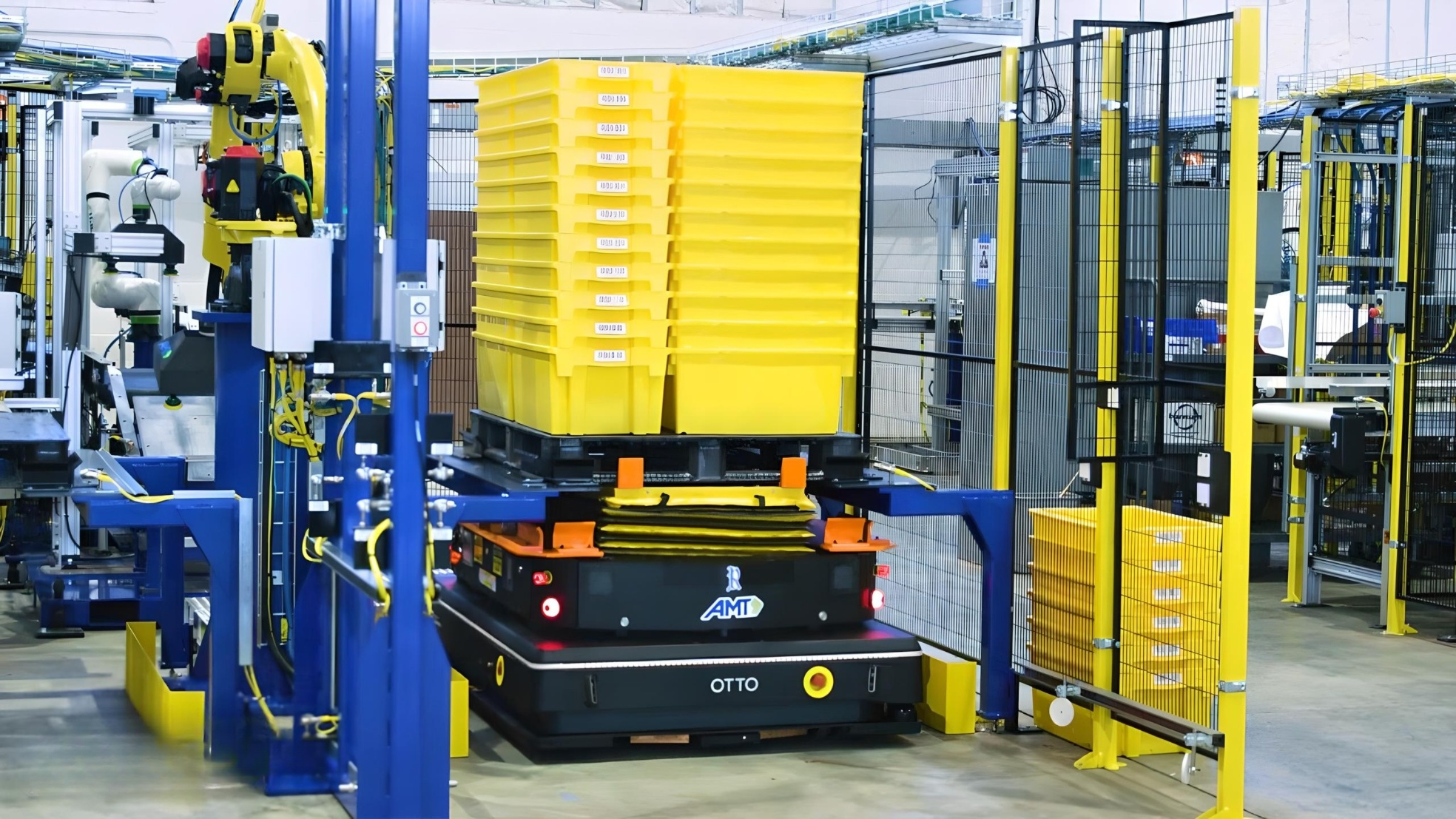 Figure 3: OTTO Motors' autonomous mobile robot efficiently transports stacks of yellow bins, streamlining material handling processes in an industrial setting. Courtesy: Applied Manufacturing Technologies (AMT)