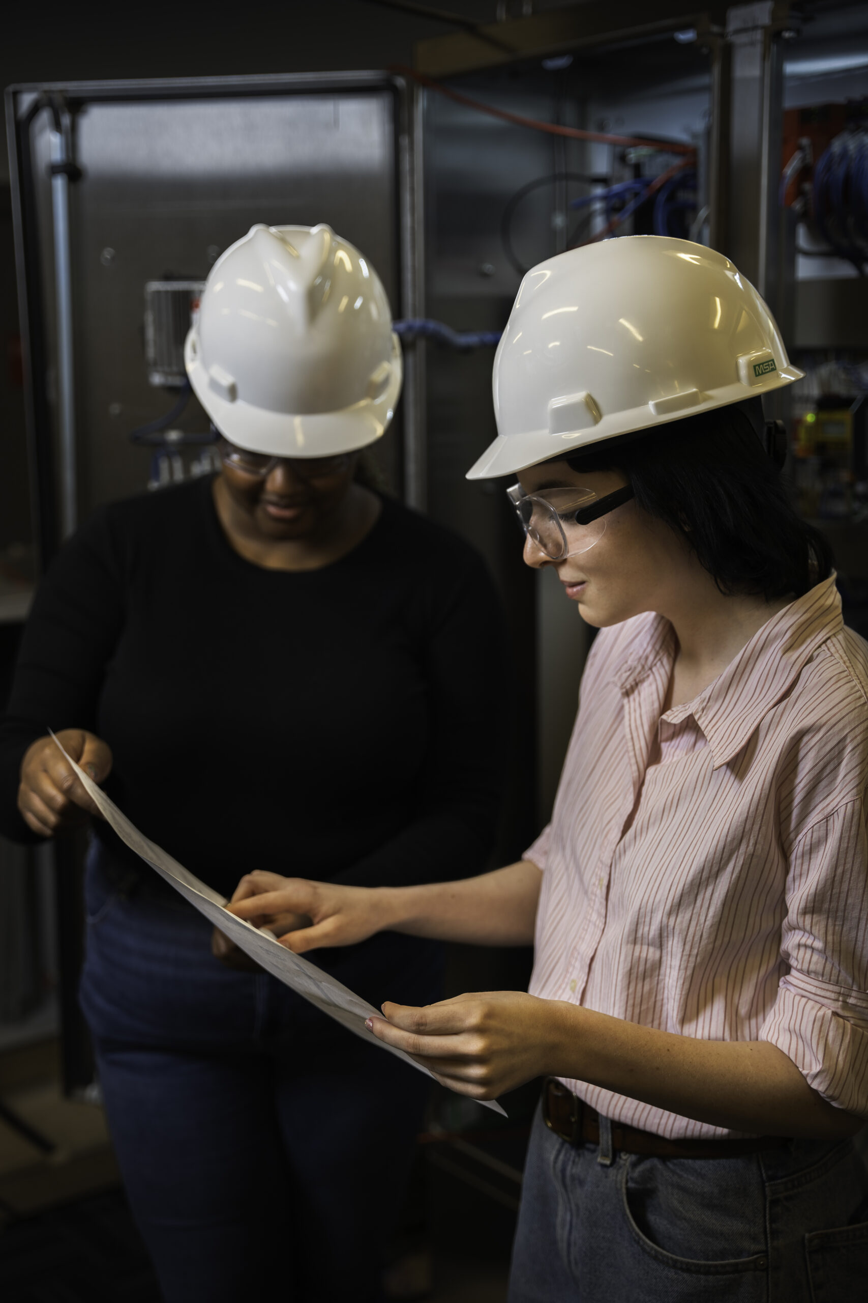 Figure 2: Automation engineers checking a piping and instrumentation diagram (P&ID). Hargrove Controls & Automation