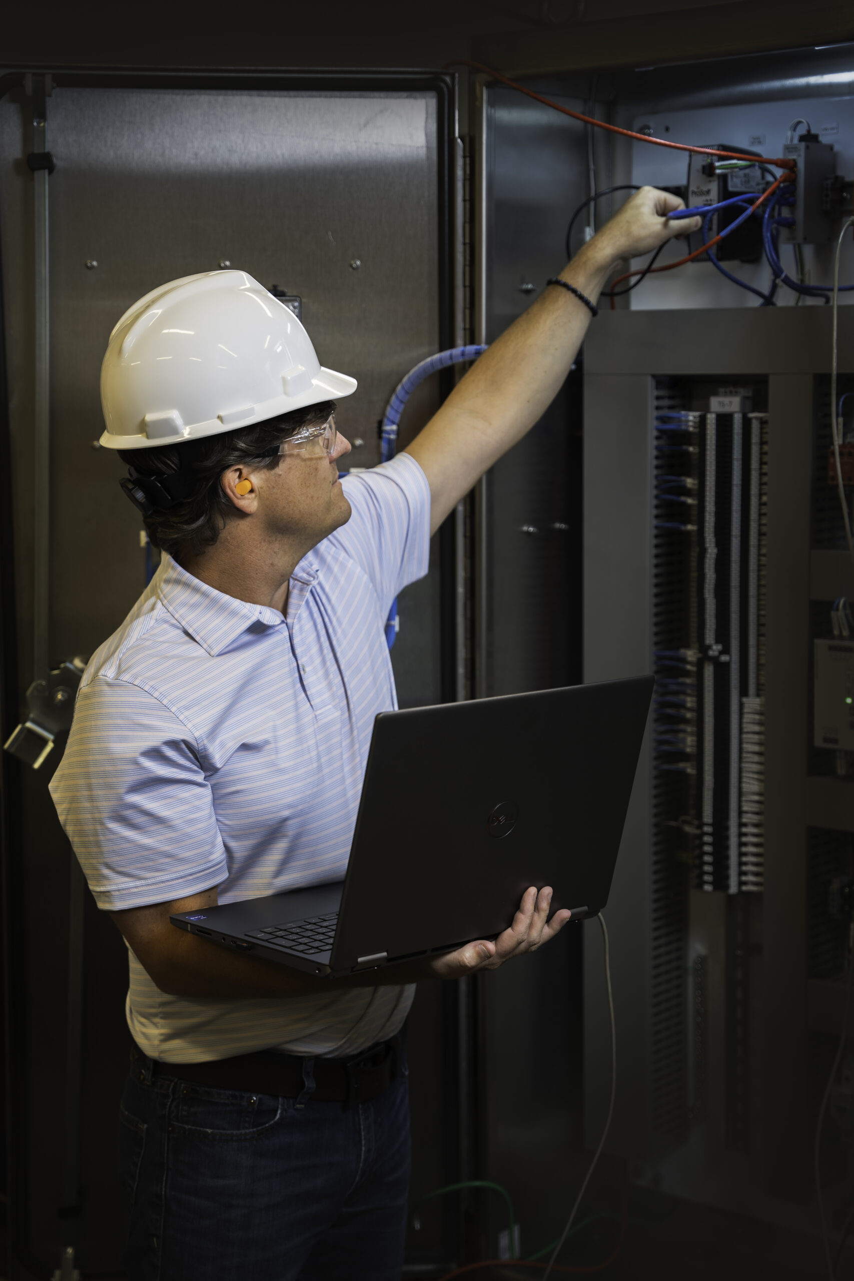 Figure 3: An automation engineer checking wiring during installation. Hargrove Controls & Automation