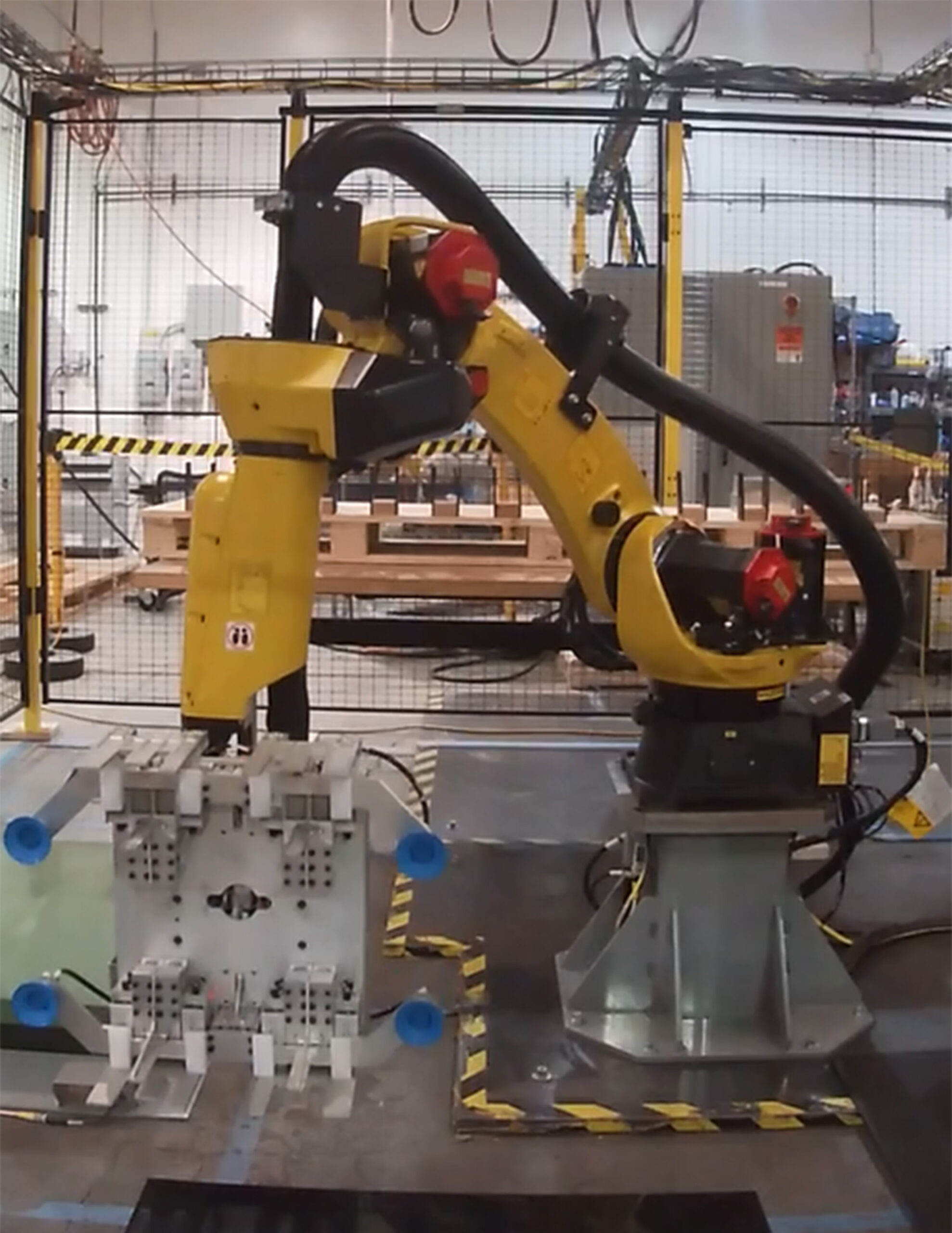 Figure 3: evriiRobot workcell equipped with a high-precision, custom end-of-arm tool (EOAT) for advanced automation capabilities. Courtesy: Concept Systems, Inc.